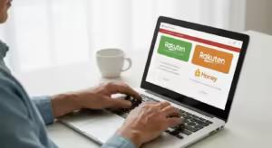 A person's hands hovering over a laptop keyboard, with browser windows displaying Rakuten and Honey extensions.